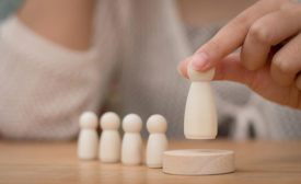 woman moving a wooden piece 