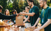 volunteers handing out food