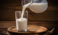 pouring milk into a cup