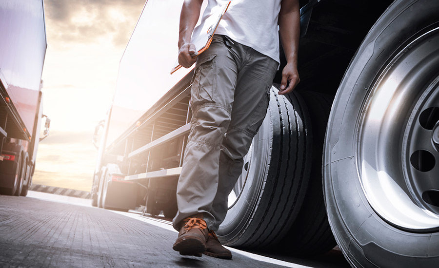 man walking by truck