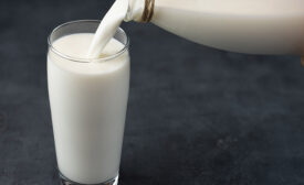 pouring milk into a cup