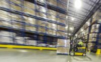 Forklift operator in a warehouse photo by Vito Palmisano for Dairy Foods